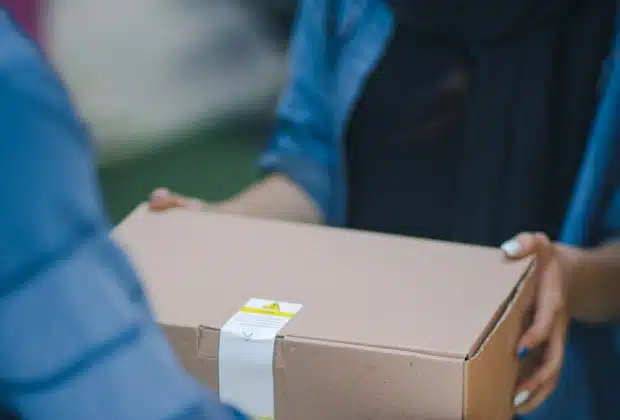 person giving brown box