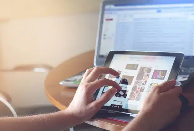 person holding black iPad